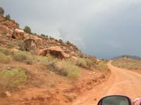 39-scenic_terrain_with_thunderstorms_in_distance