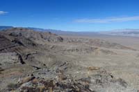 05-looking_back_to_Smith_Benchmark_and_Smith_Ridge-vehicle_parked_on_that_dirt_road_to_right_of_first_small_ridge