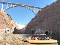 02-view_of_boat_with_Hoover_Dam_and_bypass_bridge_in_background