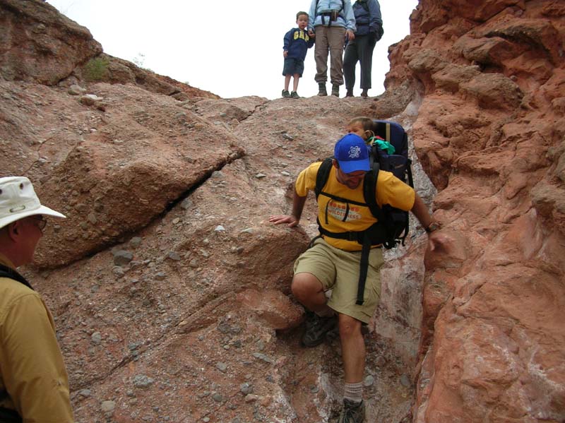 38-Joel_traversing_dry_waterfall_with_Sierra_on_back