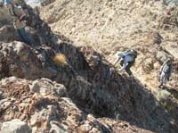 19-Dad_climbing_up_really_interesting_rock_material