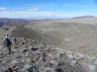 39-Poppy_and_Kenny_heading_down_ridgeline,then_steep_grade_to_drainage