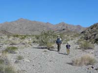 45-Poppy_and_Kenny_hiking_back_to_Hwy_93-Kenny_was_a_trooper-tired,but_continued_on