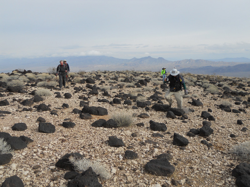 14-group_hiking_through_interesting_rock_plateau-from_Joel