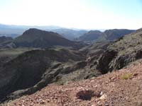 04-we'll_follow_drainage_in_center_to_Lizardback_Peak_center_right-Hoover_Dam-Bridge_Benchmark_to_left