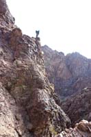 47-me_standing_on_pinnacle_scoping_out_area-no_go_on_east_side_of_canyon_from_here-from_Kay