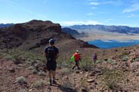 70-group_hiking_to_right_of_that_hump_to_descend_to_reach_Historic_Railroad_Trail