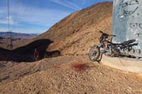 06-Kassina_coming_up_dirt_road_to_saddle-interesting_bike_trash