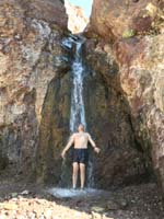 26-me_enjoying_the_warm_water_from_the_Lone_Palm_Hot_Spring_waterfall