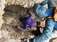 03-ascent_1_started_918am-scrambling_up_interesting_unexpected_vertical_tunnel-Luba_while_Ed_guides