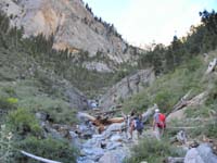 04-group_in_the_wash_to_Big_Falls-no_snow_so_go_straight_to_tree_and_boulder-otherwise_go_left