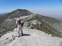 24-Jim_Ed_Luba_on_ridgeline_with_Bonanza_Peak_in_distance