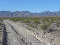 01-dirt_road_to_travel_to_peak_with_cliff_toward_left-high_clearance_vehicle_necessary
