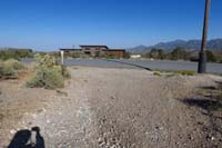 78-back_to_paved_road_for_Admin_Forest_Service_HQ,parking_area_to_R_out_of_view