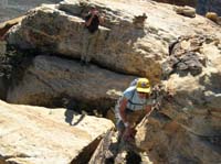 37-last_precarious_climb_to_top_of_peak