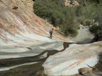 141-Erika_walking_down_steep_slick_section
