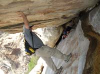150-Ali_holding_up_very_large_boulder_to_save_Jim_trapped_underneath