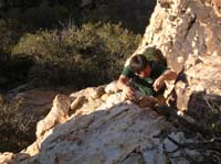 07-Colin_climbing_up_a_rock