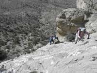 042-Ed_and_Luba_climbing_a_steep_slope_with_good_hand_holds