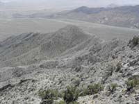 085-going_down_following_ridgeline_then_descending_to_right_of_hump_in_middle_of_picture