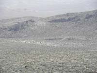 092-zoomed_view_of_approach-turns_out_not_as_easy,more_elevation_gain_and_then_downclimbing