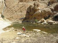 11-Kenny_thinks_water_is_cold_so_he_pulls_away-takes_off_socks_and_shoes_to_play