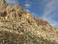 03-we_are_going_to_that_flat_area_in_center_above_clump_of_vegetation-up_from_right