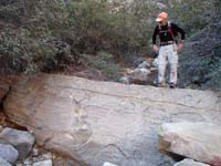 06-Jim_on_the_significant_rock_that_indicates_to_exit_the_wash_and_head_up_to_left