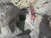 02-Sarah_and_Kenny_scrambling_in_a_small_slot_canyon