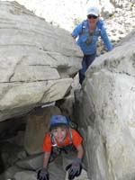 07-Sarah's_turn_to_climb_through_the_tunnel_as_her_Mom_climbs_over