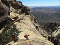 22-Ed_and_Luba_travel_along_exposed_ledge