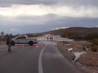 41-1540pm-wash_flowing_across_Hwy_159-road_closed-flood_not_bad-people_walked_across-too_bad_blurry