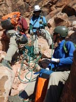 28-me_feeding_the_rope_to_Richard_stuffing_in_bag-from_Luba