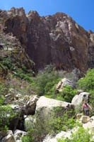 58-Kristi_bouldering_with_Black_Velvet_Peak_in_background
