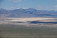 44-scenic_view_from_peak-NNW-zoom_view_of_dry_lakebed_with_military_vehicles