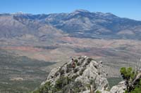 45-zoom_picture_of_group_scrambling_with_Spring_Mountains_in_distance