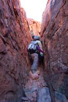 05-squeezing_through_a_short_slot_canyon