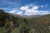 48-looking_back_to_pretty_forest_scenery_and_snow_covered_peaks