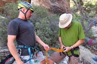 43-Brett_helping_Mike_prepare_rappelling_gear-we_provide_instructions