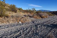 21-looking_back_at_trail_while_crossing_a_wash,floods_damaged_trail