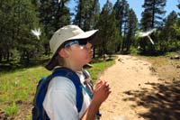 20-Kenny_blowing_dandelion_seeds-fun_blowing_many