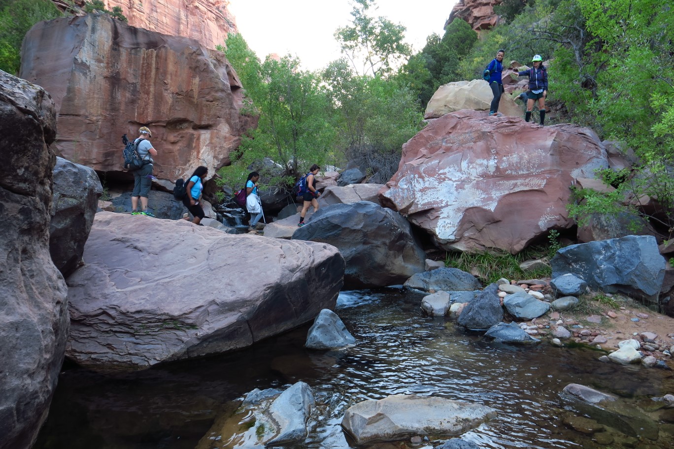 026-group_boulder_hopping_across_the_stream