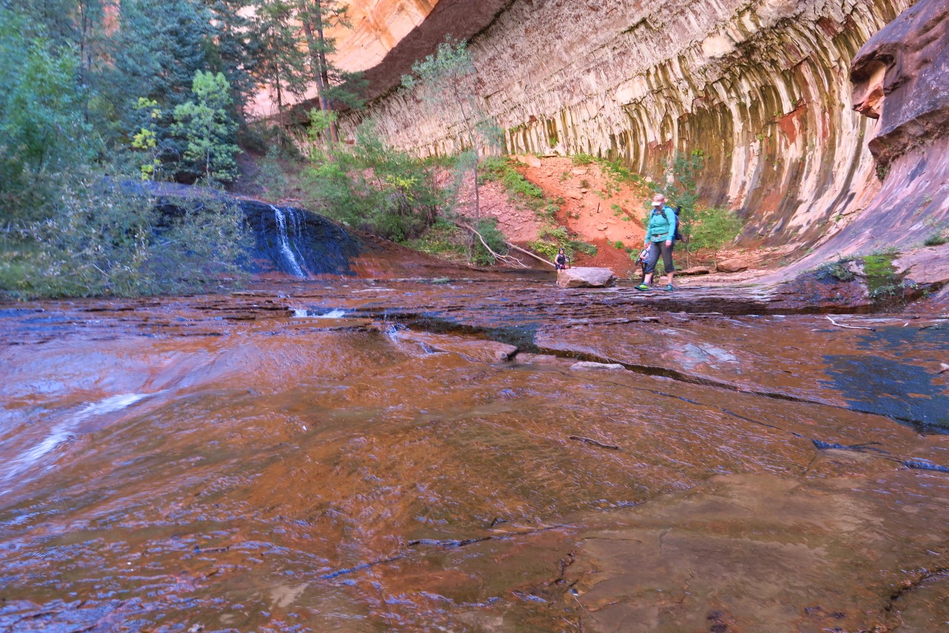 122-Kristi_passing_by_cascading_waterfall