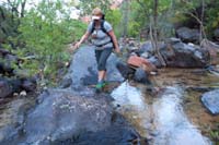 030-Kristi_walking_on_the_boulders_along_the_stream