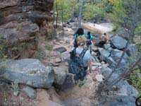 032-group_carefully_crossing_the_stream,one_of_many_times-via_GoPro